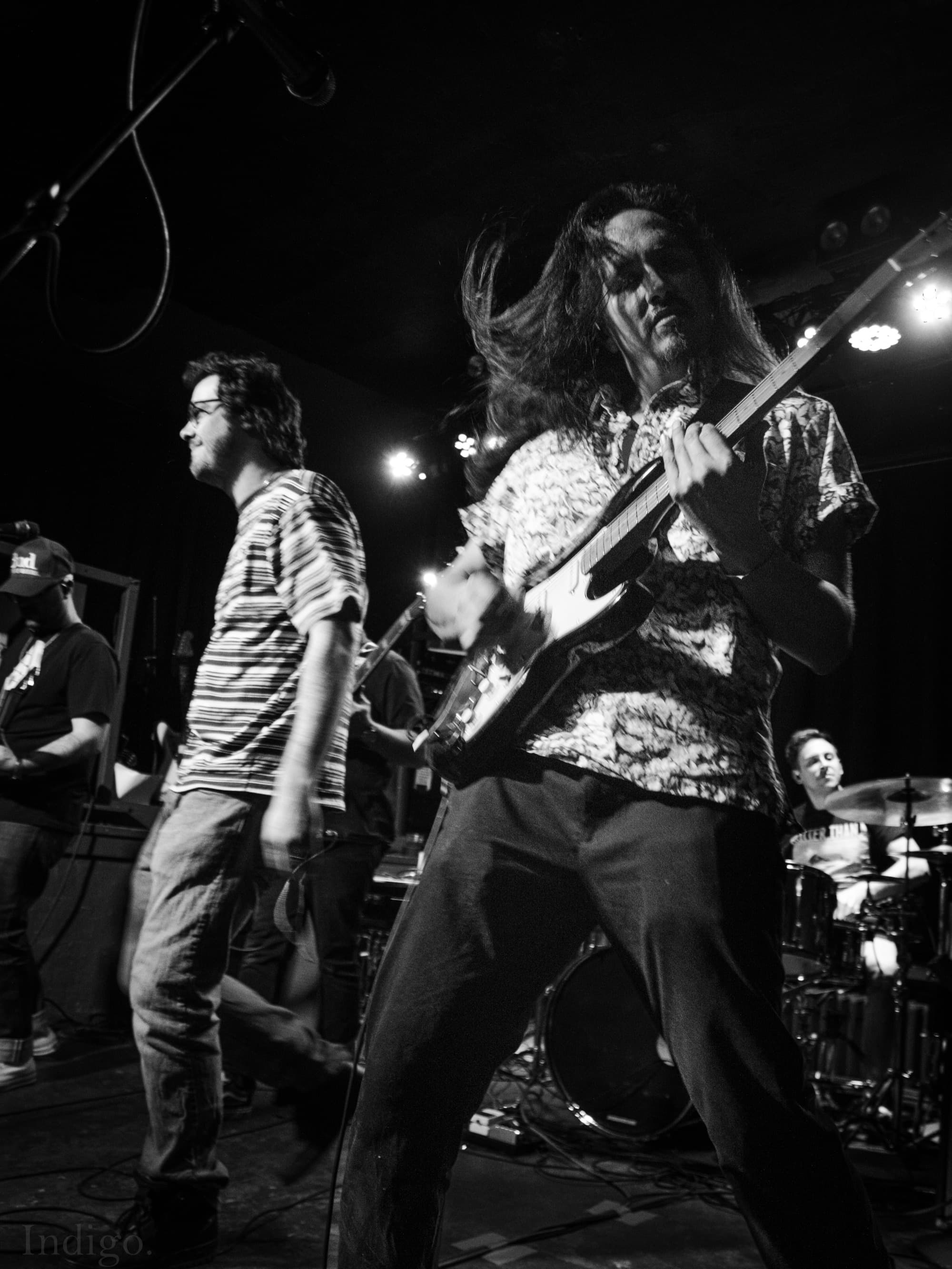 Vocalist and guitarist in black and white