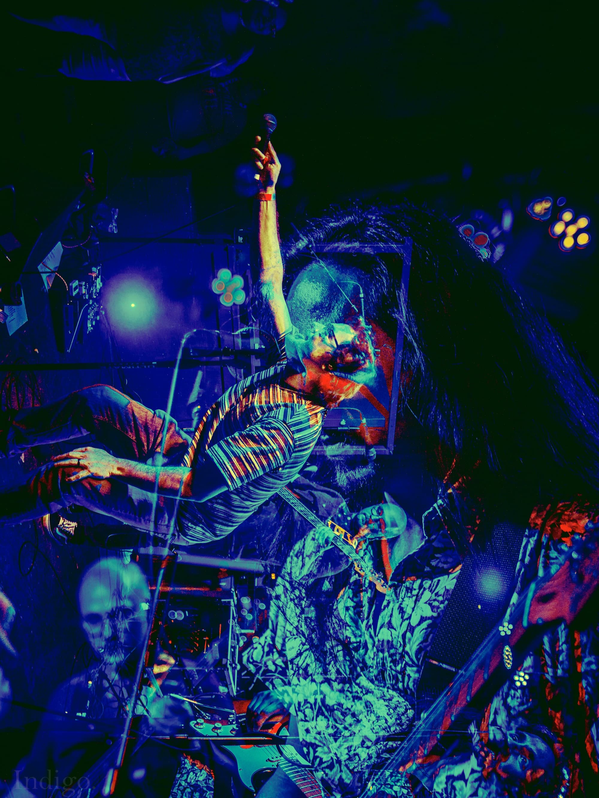 Double exposure guitarist with neon colors