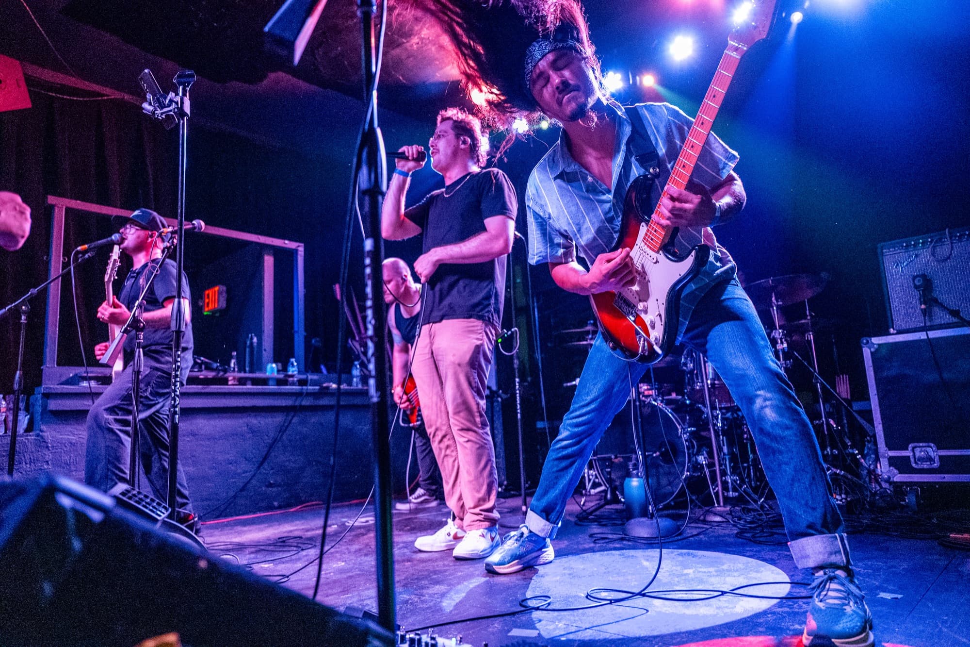 Band members rocking out on stage